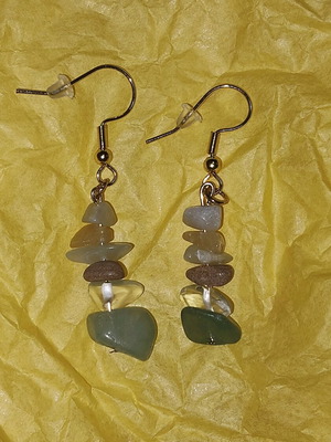 Handmade earrings with stones in orange, white and green shades