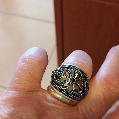 Silver-colored ring with stones like new