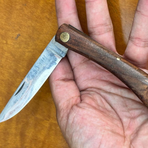 Vintage folding pocket knife with wooden handle, used, 10.7 cm
