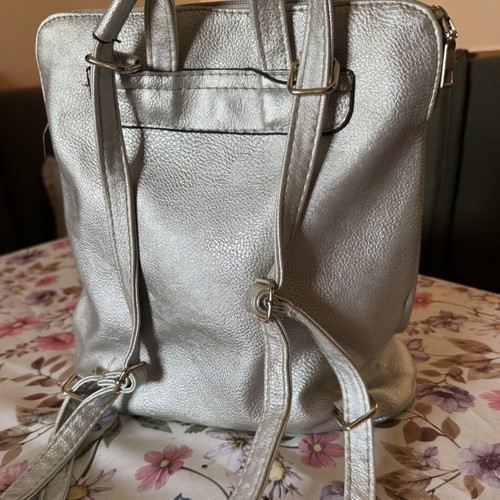 Backpack like new gray silver leatherette with three zippers