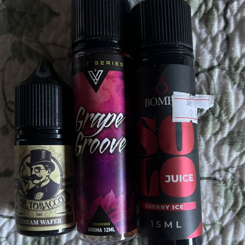 Vape juice pack with grape groove, cherry ice, and cream wafer used