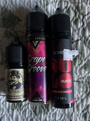 Vape juice pack with grape groove, cherry ice, and cream wafer used