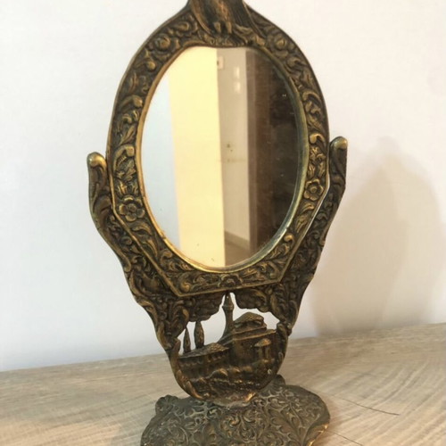 Set of two brass mirrors, table and hand used