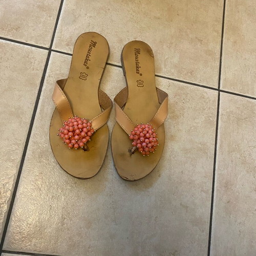 Leather sandals used with orange glass bead flower