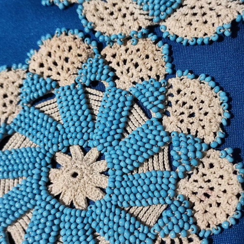 Handmade knitted doilies used with crochet and beads