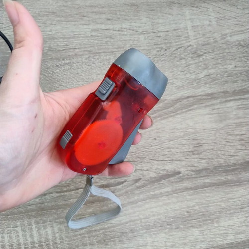 Portable Dynamo Flashlight like new, hand-press charge, no batteries