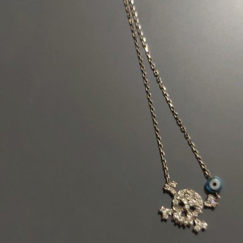 Pendant necklace with thin chain, used with skull and blue eye