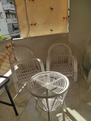 Balcony chairs and table used, white color