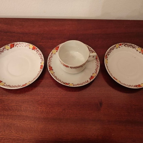 Decorative tea saucers with one cup used