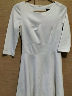 White dress used, size S, elegant design with long sleeves