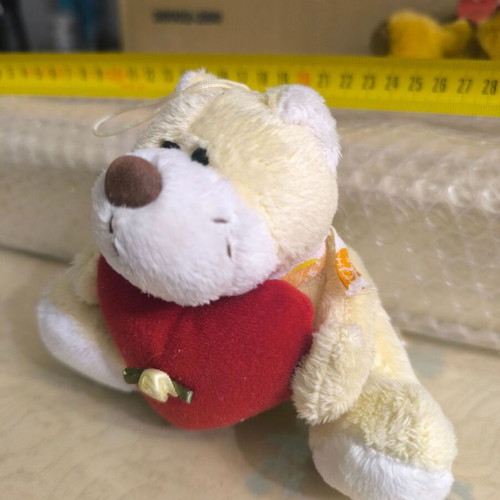 Small teddy bear with heart like new