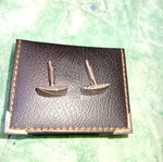 Silver cufflinks in book-style case