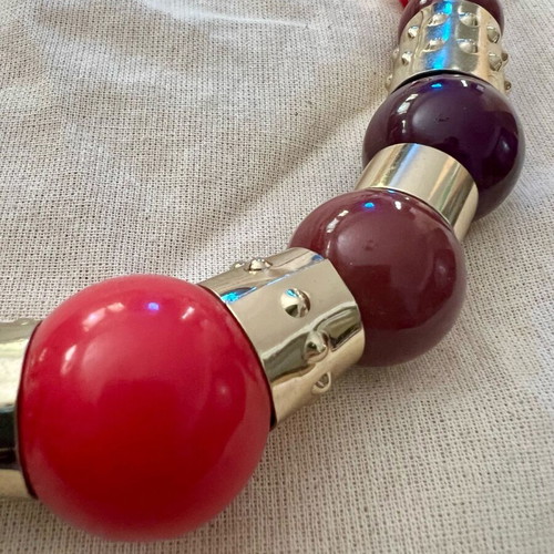 Statement necklace with large beads used, purple and gold details