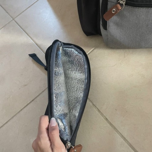 Baby bag with thermos holder and changing mat used