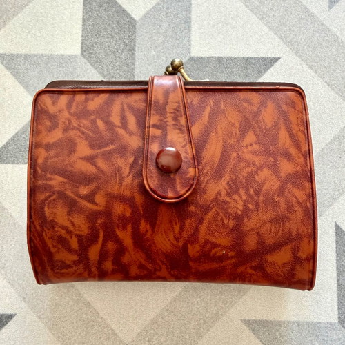 Vintage brown leather wallet used with frame closure