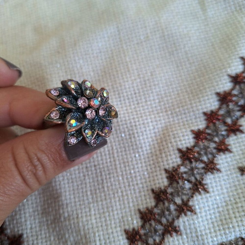 Bronze flower ring with pink rhinestones used