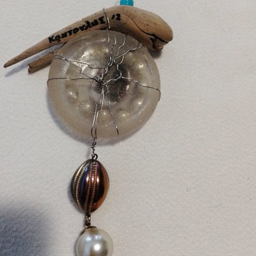Signed micro-sculpture used, with glass, wood, beads