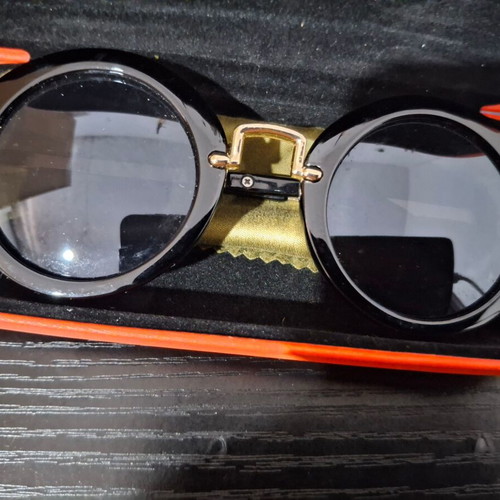 Women's sunglasses used with case and cleaning cloth, black and gold