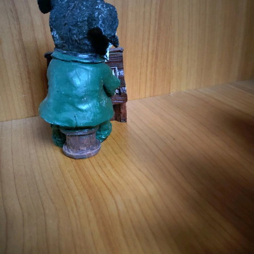 Decorative dog figure with piano like new