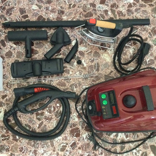 Steam cleaner like new with accessories for cleaning and ironing