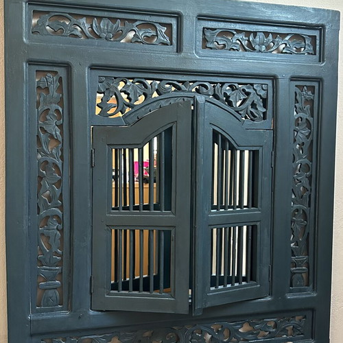 Handmade woodcarved window with traditional art design