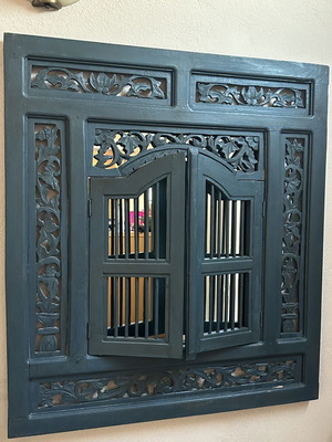 Handmade woodcarved window with traditional art design