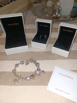 Pandora silver bracelet with 11 charms and collectible clasp, like new