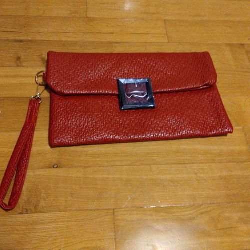Vintage style red clutch unused with clasp and wrist strap