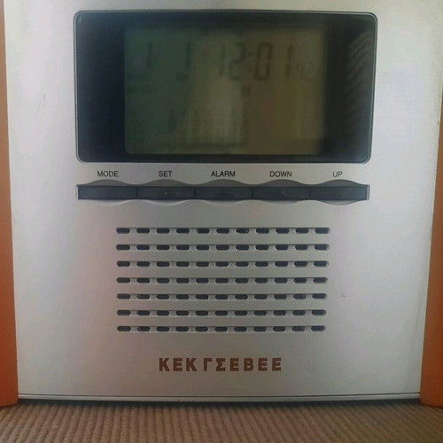 Retro digital tabletop clock with day, month, and year display