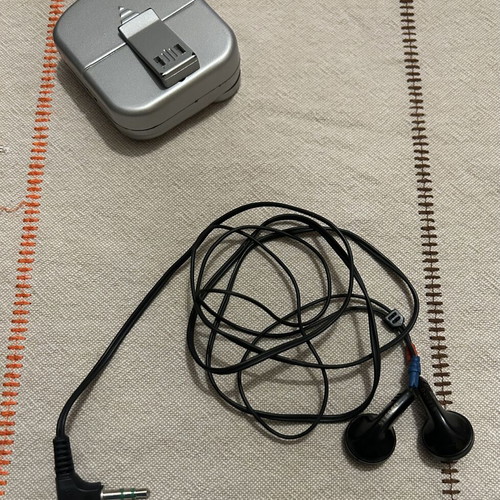Pocket Radio with Headphones like new, silver color