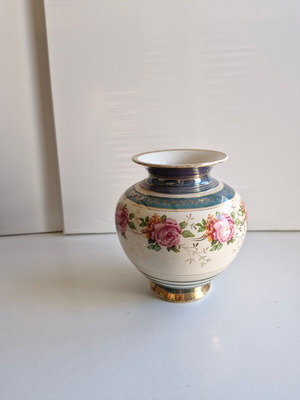 Vintage vase with floral decorative elements, like new