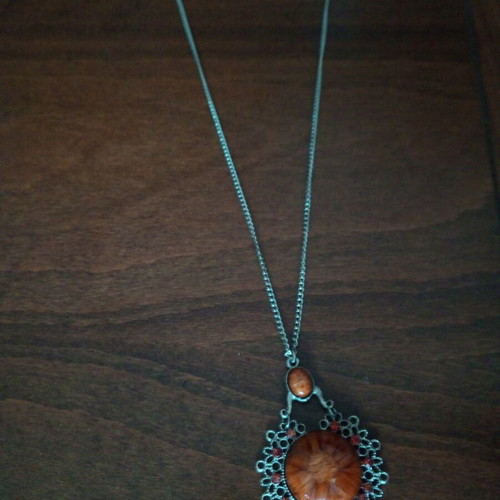 Pendant with glass light brown cabochon used, fashion jewelry