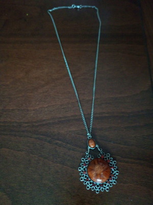 Pendant with glass light brown cabochon used, fashion jewelry