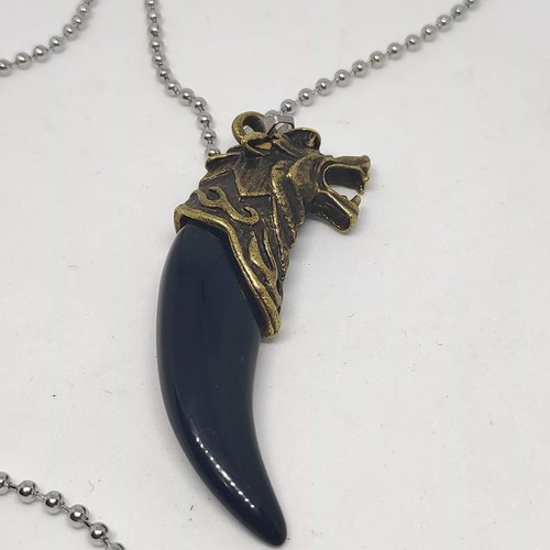 Necklace with wolf tooth pendant like new, gold and black