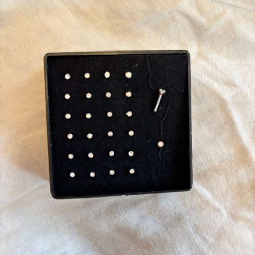 Nose earrings used, box included