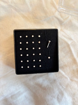 Nose earrings used, box included