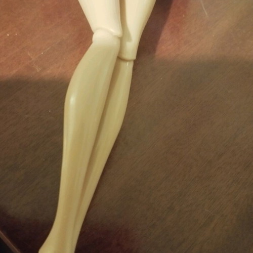 Doll with pink earrings and articulated joints used