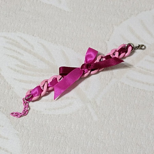 Pink bracelet with chain and bow, new