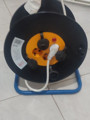 Power extension reel with 4 sockets and long cable, like new