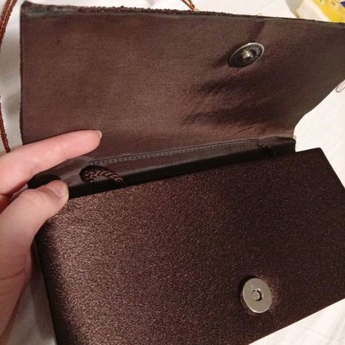Official hand bag like new in brown shades with sequins