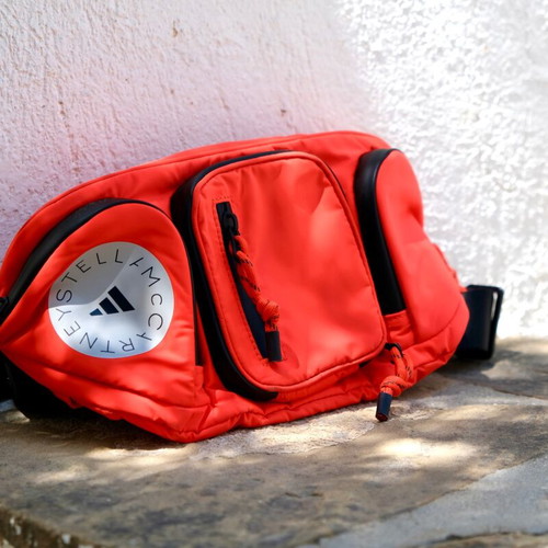 Adidas Stella McCartney large waterproof waist bag, black and orange