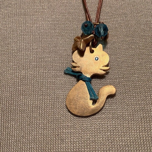 Cat design necklace like new, double brown leather cord with blue beads