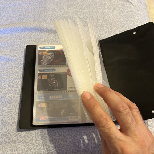 Phone card album with 32 universe-themed cards and 50 extra sleeves like new