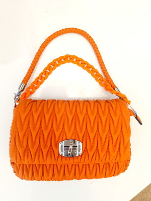 A.S. 98 embossed orange handbag with braided handle and chain