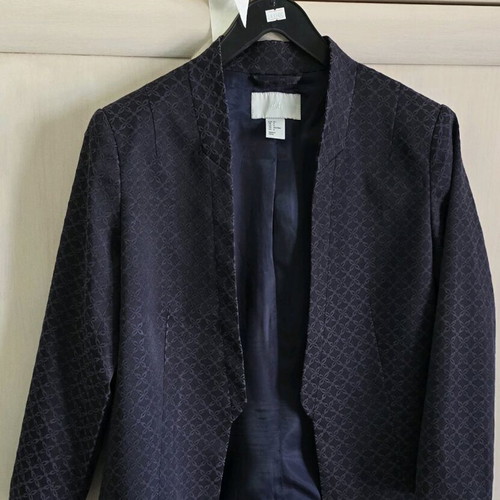 Black H&M jacket with three-quarter sleeve and purple embroidery size medium like new