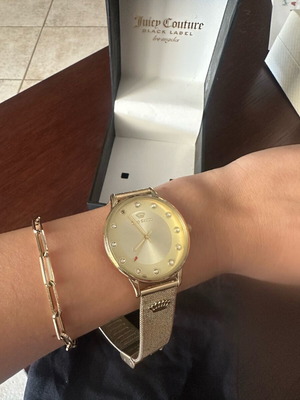 Juicy Couture gold wristwatch used with protective sticker