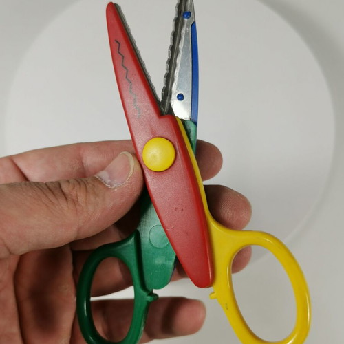 Craft scissors used with colorful zig-zag cuts for kids