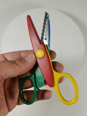Craft scissors used with colorful zig-zag cuts for kids