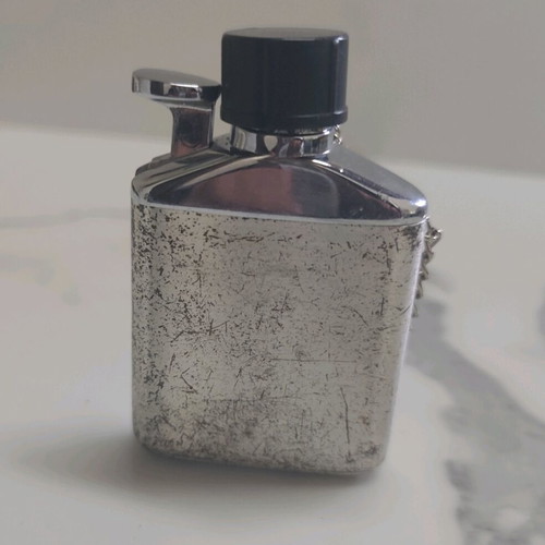 Vintage lighter used, flask design silver color