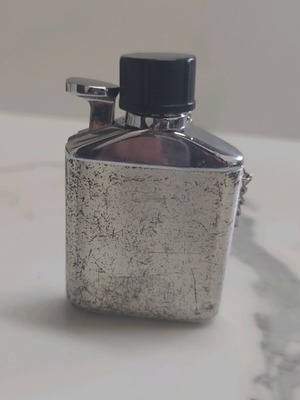 Vintage lighter used, flask design silver color